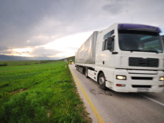 Big truck drive on long country road